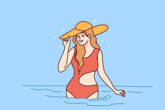 Smiling woman in swimsuit in sea