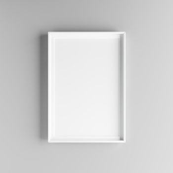 Elegant and minimalistic picture frame standing on gray wall
