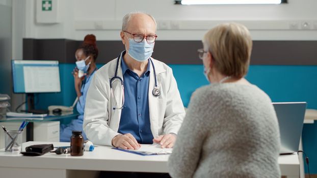 Male doctor doing checkup consultation with sick woman