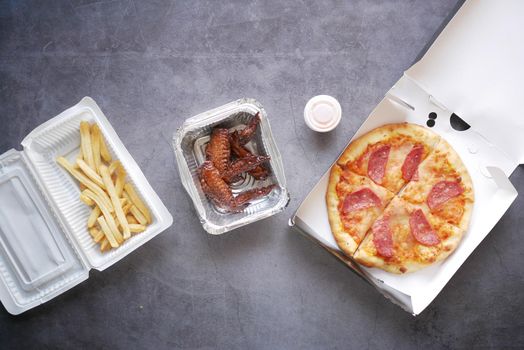 junk foods on a take away box on table