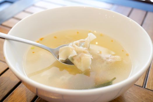 Dumpling Soup in a bowl on table,