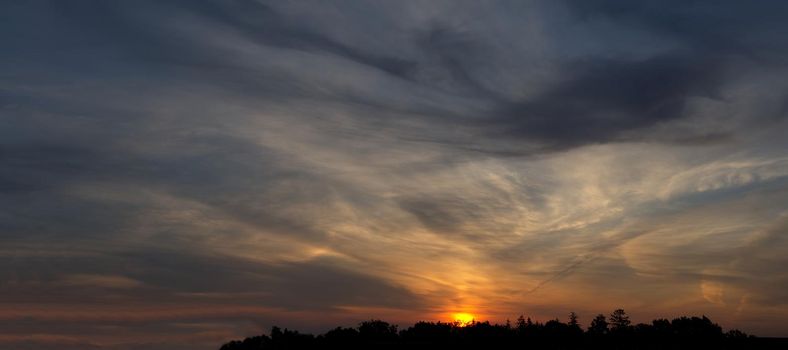 Panorama view of sunset with multicolor clouds