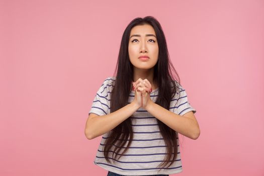 Portrait of asian young woman on pink background.