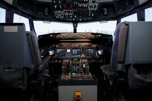 No people in empty plane cockpit with dashboard command