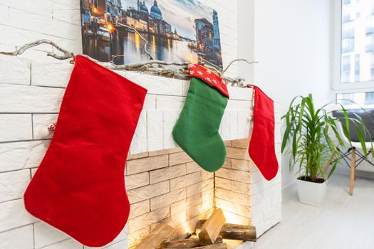 Christmas stocking on fireplace background.