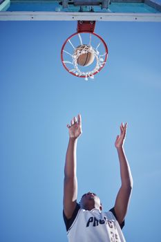 Fitness man playing basketball on a sports court. Fitness man playing basketball on a sports court.