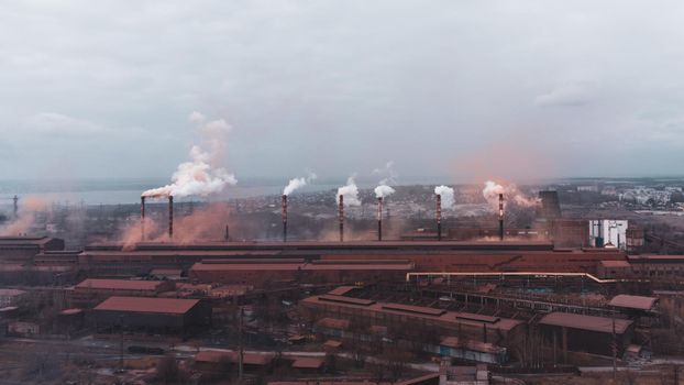A chimney chemical plant in the discharge of pollutants, Industry Pipes Pollute the Atmosphere With Smoke