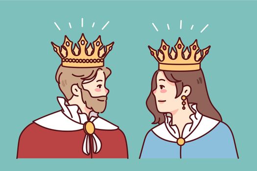 King and queen in mantles and crowns