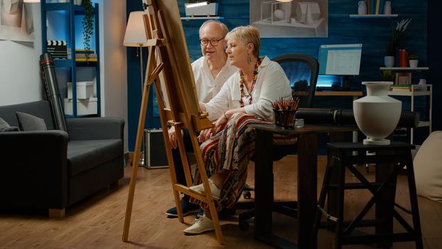 Retired people with artistic skills drawing authentic vase design