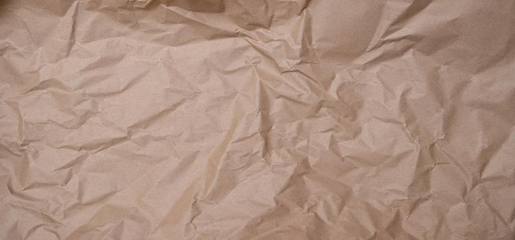 crumpled brown blank paper. Rumpled brown cardboard paper texture