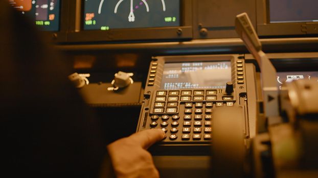 Plane captain using dashboard buttons to insert coordinates