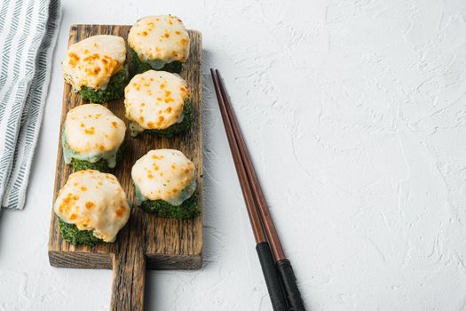 Japanese sushi rolls named Baked Ebi with wasabi and salmon fish, on white stone background , with copyspace and space for text