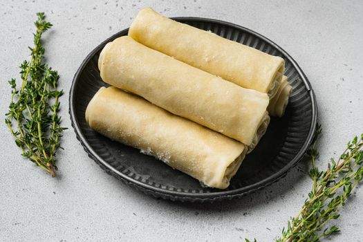 Crepes frozen on gray stone table background