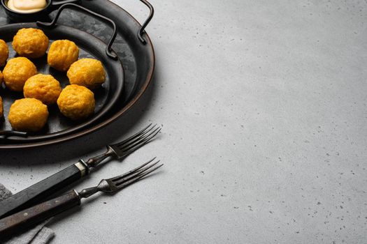 Battered meat on gray stone table background, with copy space for text