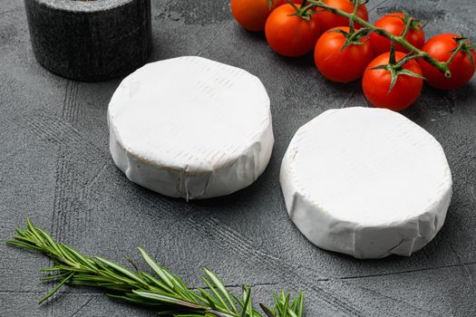 Creamy Brie cheese on gray stone table background