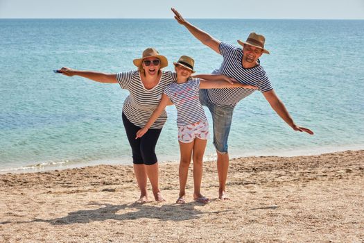 Happy family on the beach. Holiday travel concept