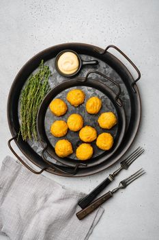 Breaded chicken fillet and batter on gray stone table background, top view flat lay