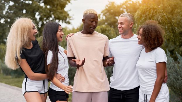 Multi-ethnic group people teenage friends. African-american, asian, caucasian student spending time together Multiracial friendship