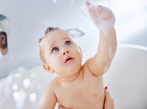 I dont mean to burst your bubble but Im the cutest. Shot of an adorable baby boy taking a bath at home.