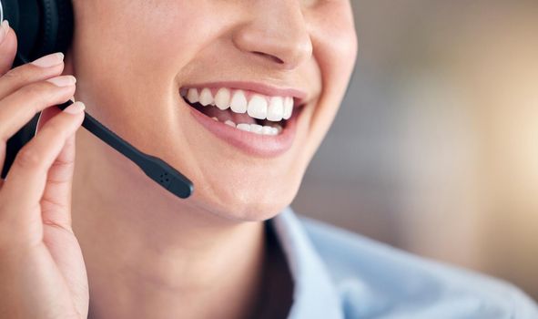 Cropped Close Up of a unknown smiling mixed race call centre agent talking to customers with a wireless technology headset. Hispanic businesswoman answering calls, helping clients from an office. Headshot of a female customer service representative
