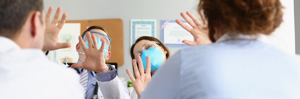 Medical workers protect from patients wearing face mask and glasses