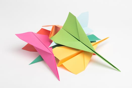 The sky is the limit when it comes to creativity. Studio shot of a pile of colourful paper jets.