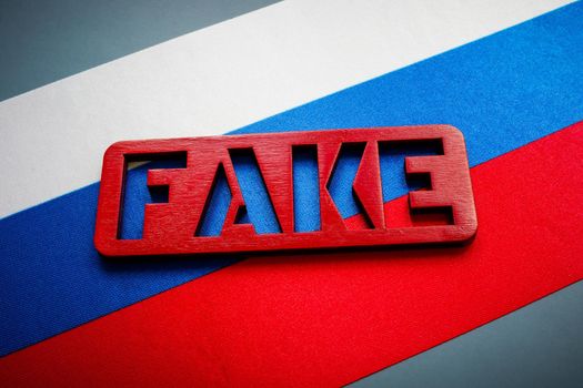 Russian flag and fake sign. Propaganda concept.