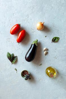 Mediterranean cuisine vegetables, top view, grey background