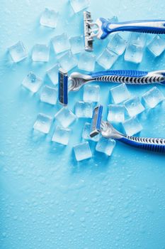 Refreshing shaving machines for the face against the background of frosty ice cubes
