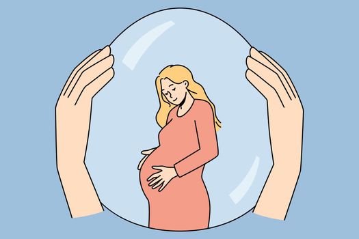 Hand holding pregnant woman in safety bubble