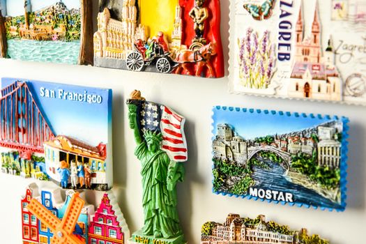 Magnets on refrigerator from travelling - stock photo, souvenir shopping