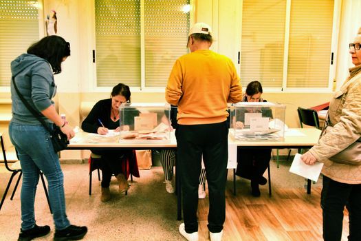 Citizens voting in a polling station in Spain