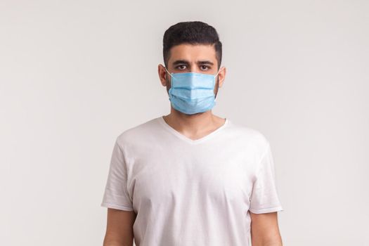Man wearing hygienic mask to prevent infection, airborne respiratory illness