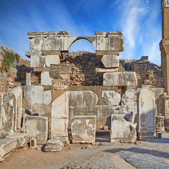 Ancient city ruins of Ephesus in Turkey during the day. Traveling abroad and overseas for holiday, vacation and tourism. Excavated remains of historical building stone of Turkish history and culture