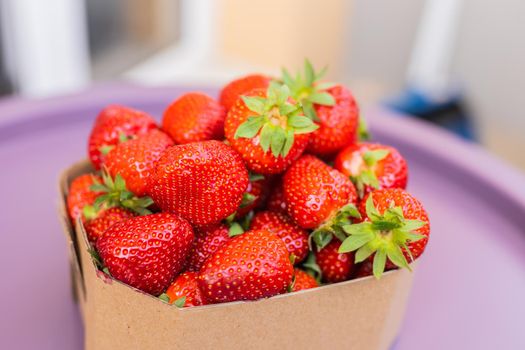 Fresh strawberries in box, summer berry - healthy food and vitamin concept