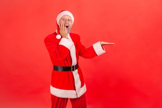 Emotional santa clause on red background.