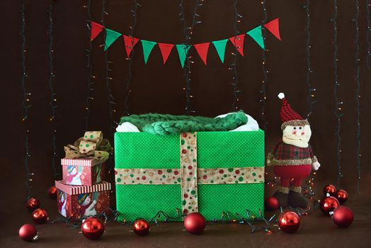 Background for newborn photos. Green box and Christmas decorations.