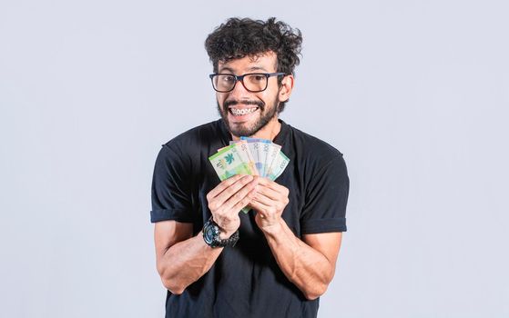 Happy man with money in hand, Excited person with money in his hand isolated, astonished people with banknotes in his hand