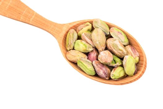 Pistachio nuts without shell in spoon