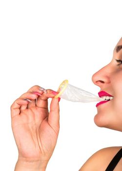 Woman holding condom in teeth