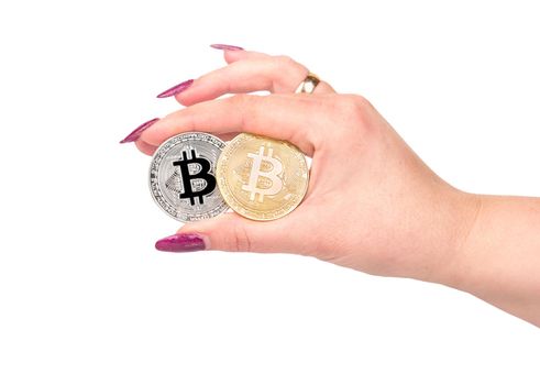 Bitcoin coins in hand