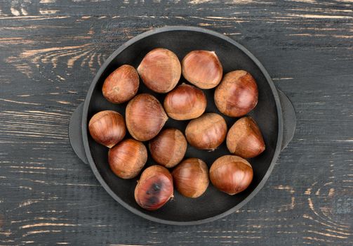 Fresh chestnuts in pan