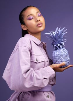 If purple is your colour then its your colour. Studio shot of a beautiful young woman modelling a purple colour concept.