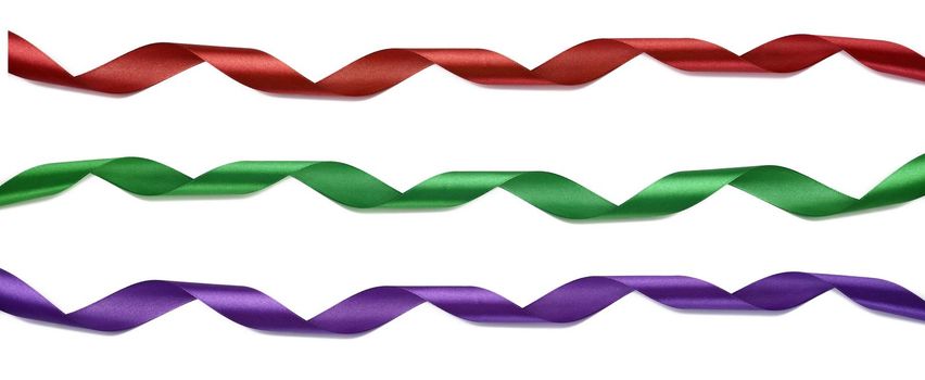 Twisted silk red, blue and purple ribbons for decoration on a white isolated background