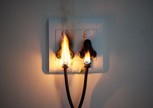 I hope youve got insurance. two plugs in a wall socket catching fire.
