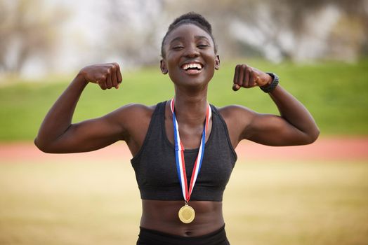 Strong body, strong mind. Cropped portrait of an attractive young female athlete celebrating her victory.