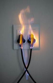 It can happen to anyone. two plugs in a wall socket catching fire.