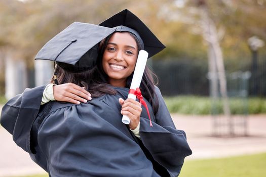 I hope well continue to be besties forever. Portrait of a young woman hugging her friend on graduation day.