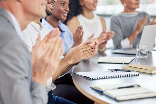 Their talk was filled with such helpful information. Closeup shot of a group of businesspeople applauding during a meeting in an office.
