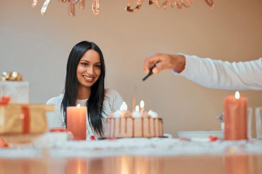 I have so many wishes to make. a young couple celebrating a birthday at home.